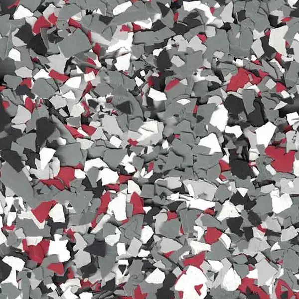 The image displays a textured pattern composed of scattered, multicolored flakes in red, gray, white, and black, creating an abstract mosaic.