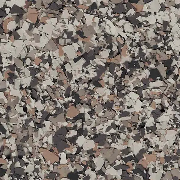 A close-up of a textured surface with a mix of gray, beige, and brown colors resembling a scattered, abstract pattern or terrazzo floor.