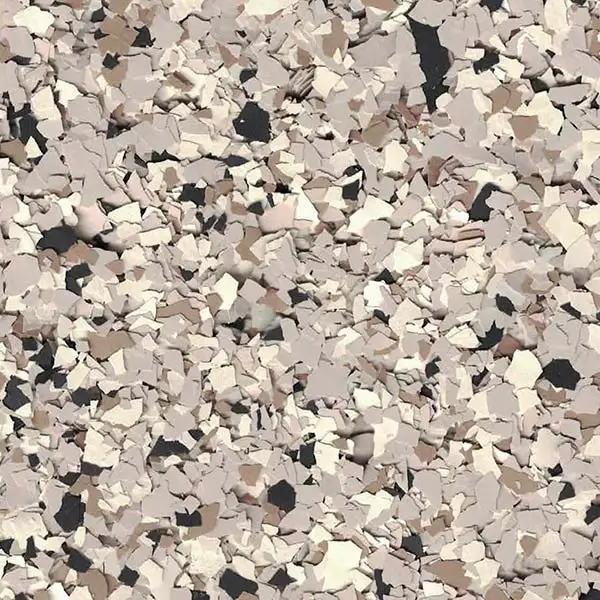 A textured, beige-and-brown speckled surface resembling decorative flooring or wall covering with irregularly shaped fragments in various shades.