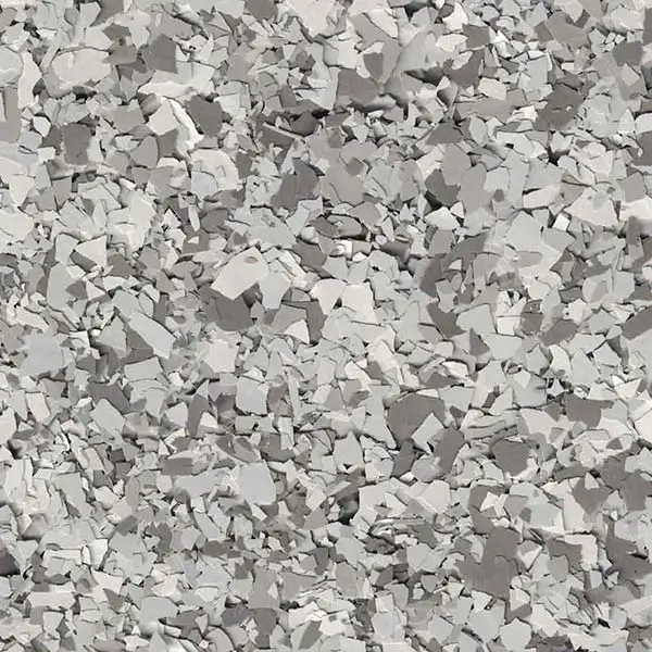 A textured surface with various small, irregular gray and white rocks or cement pieces closely packed together, creating a rugged, stony appearance.