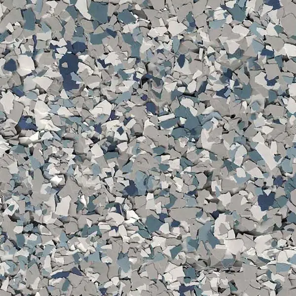 A textured surface with a mixture of gray, white, and blue fragments resembling small, scattered stones or chips on a flat plane.