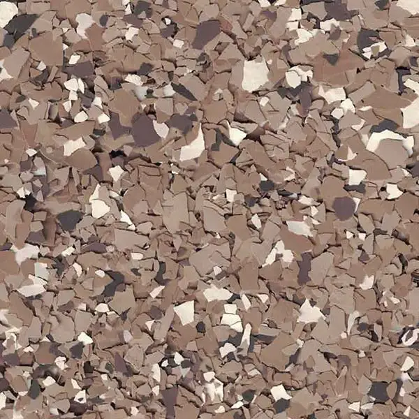 A textured surface featuring a mix of brown, beige, and black speckles, resembling stone or granite. No landmarks or buildings visible.
