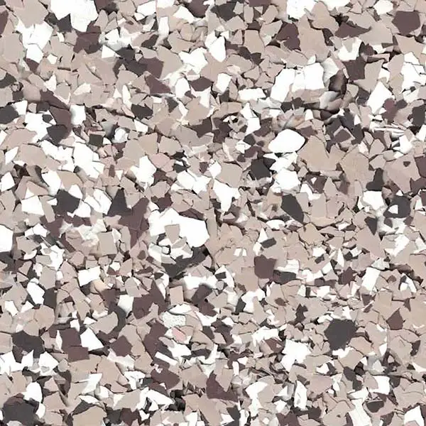 A close-up image of a textured surface with scattered beige, white, and brown flakes, resembling terrazzo or mosaic flooring, fills the frame.