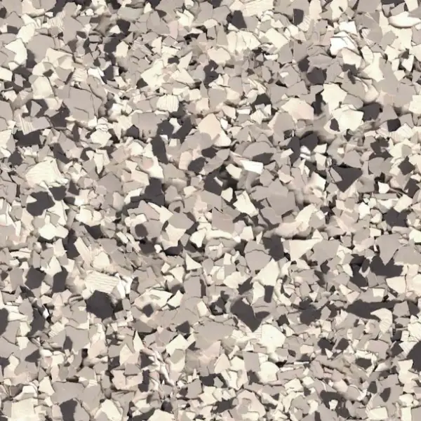 A textured surface with irregular, jagged, gray and white chips clustered together, creating a rough, abstract, and visually dynamic pattern. No landmarks visible.