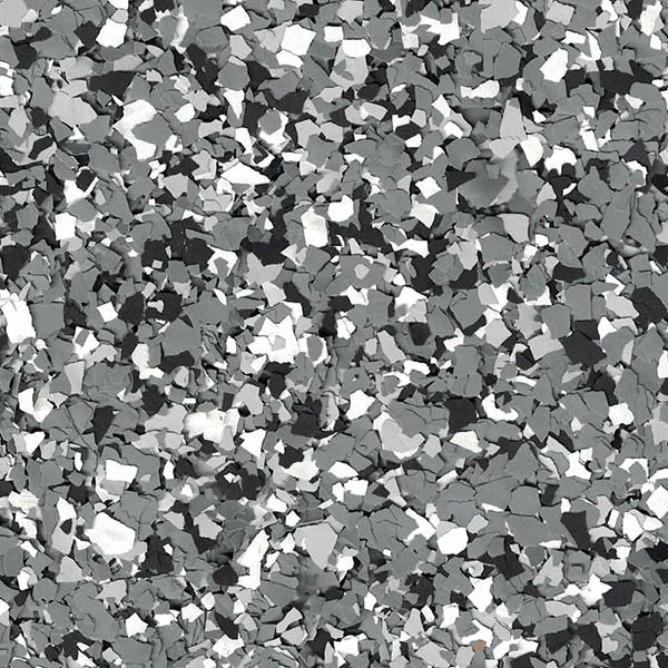 Abstract pattern featuring a mixture of gray, black, and white fragmented shapes, resembling a terrazzo design for flooring or decorative surfaces.
